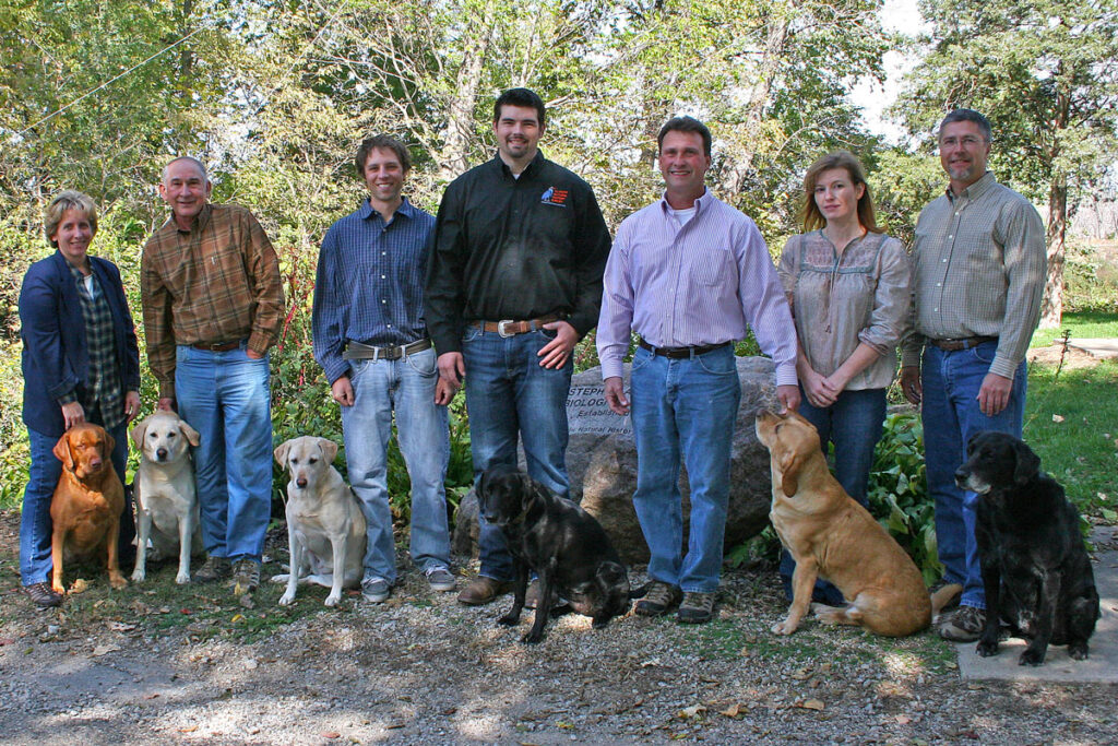 Seven staff members with 6 dogs, 2012.